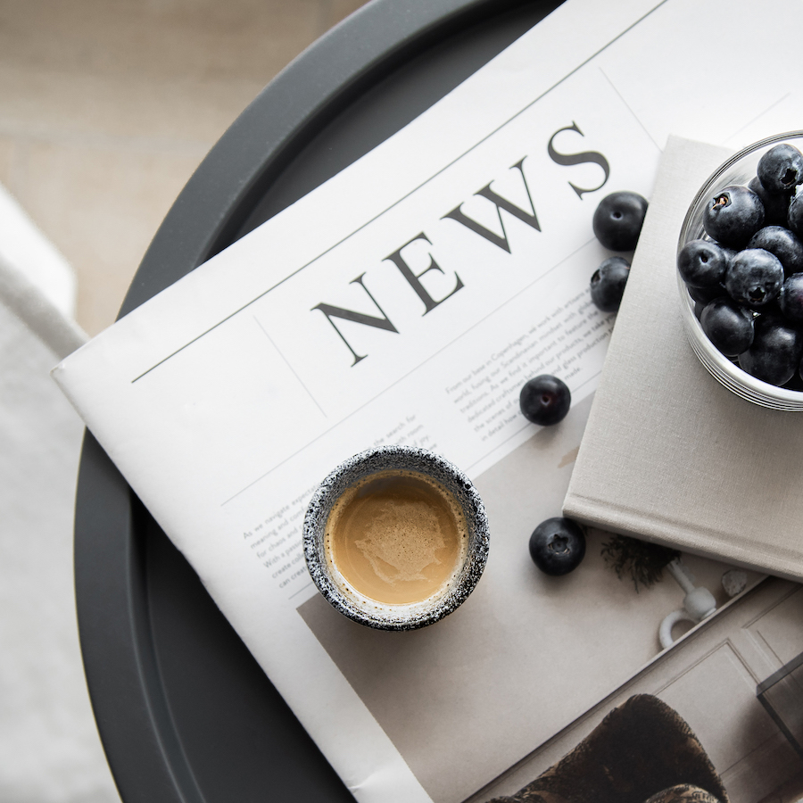 News on table with blueberries